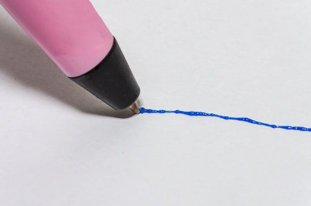 Man draws a line with a 3d penの写真素材