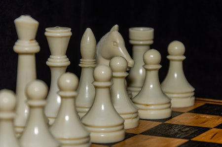 Man playing chess on a chessboardの写真素材