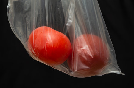 Fruits in a transparent plastic bagの写真素材