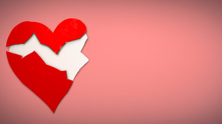 Red broken heart on a pink background with copy space for your textの素材