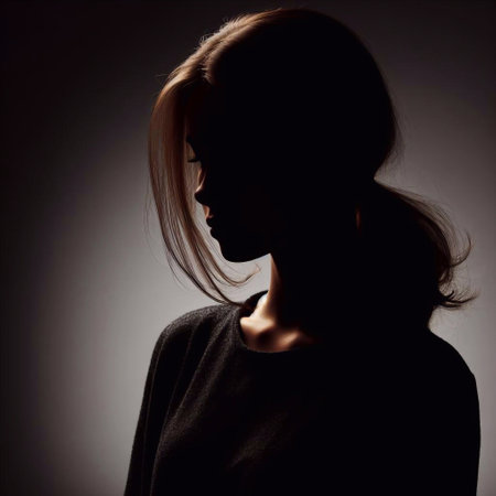 Portrait of a beautiful young woman with long hair in the studio.の素材