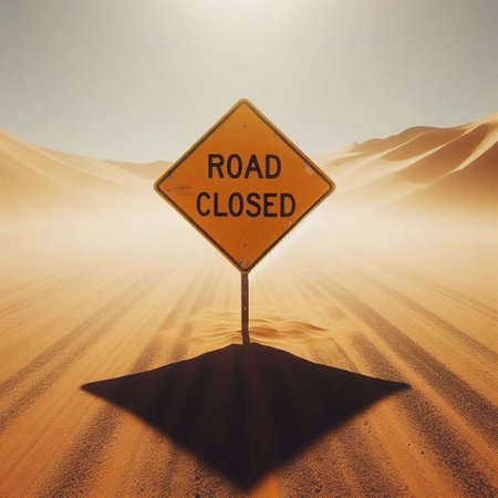 Road closed sign in the Sahara desert, Morocco. Conceptual image.の素材