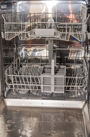 Dishwasher with clean utensils. Dishes in the kitchen.の写真素材