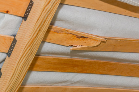 Detail of a wooden clothes hanger in a storage room.の写真素材