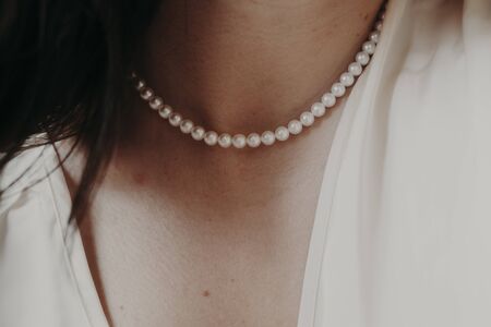 pearl necklace on a girl's neckの写真素材