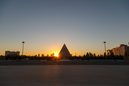 Astana, Kazakhstan - September 4, 2016:  The sun sets behind the Palace of Peace and Reconciliationのeditorial素材