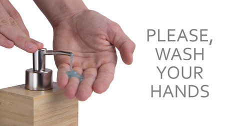 Washing hands with soap dispenser isolated. With example of phrase and pouring soapの写真素材