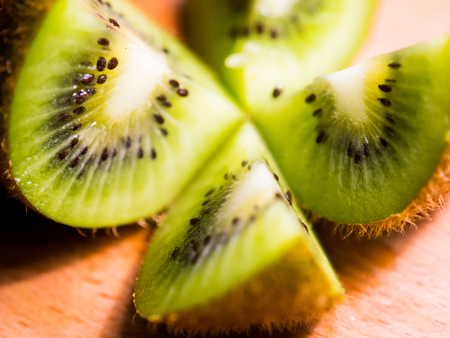 Kiwi, cut into slices, closeup. Background with kiwi fruitの写真素材