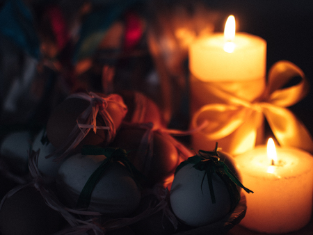 Easter composition. Candles burn in the darkの写真素材