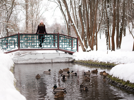 Young woman at winter. Girl walking in the park.の写真素材