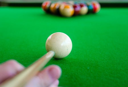 Placement of billiard balls on the table before the game. Focus on the white ballの写真素材