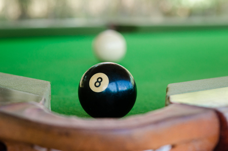 Win ball. Black eight ball in the pocket