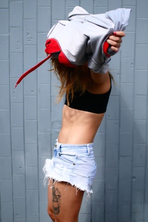 Sexy young girl. A woman shows her press and body. Sports motivationの写真素材