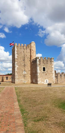 Santo Domingo, Dominican Republic -January 26, 2022. Medieval Tower Fortaleza Ozama with Dominican Flagのeditorial素材