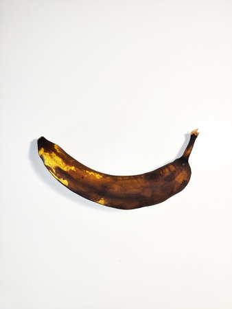 Photo of Single Overripe Banana on White Backgroundの写真素材