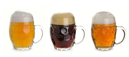 three mug of dark, white, light beer on a white backgroundの写真素材