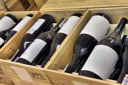 Red and white wine in bottles in wine shop