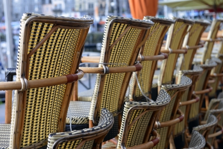 stacked chairs in front of the opening of the restaurant