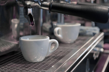 Espresso pouring into a cupの写真素材