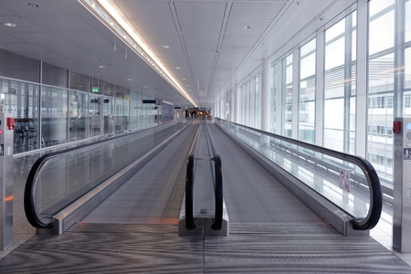 long horizontal escalator at international airport terminalのeditorial素材