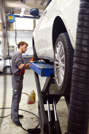 Italy, Desio, 26 october, 2018, Car technician repairing car in workshop service station,  Italy, Desio, 26 october, 2018のeditorial素材
