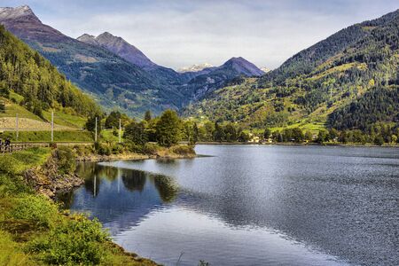 beautiful view of a mountain lake in the autumn sunny day. Poschiavo, Switzerlandの写真素材