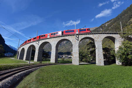 Switzerland, Brusio, 10.10.2019, Swiss mountain train Bernina Express passes the spiral of the...
