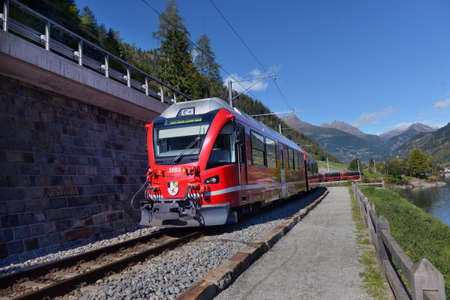 Switzerland, Poschiavo, 10.10.2019, Bernina Express train in the mountains of Switzerlandm Switzerland, Poschiavo, 10.10.2019のeditorial素材