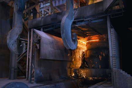 Melting of metal in a steel plant. High temperature in the melting furnace