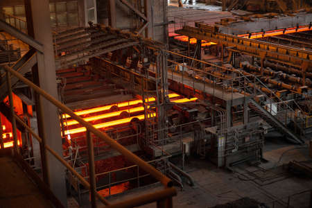 Steel production in electric furnaces. Sparks of molten steel. Electric arc furnace shop. Metallurgical production, heavy industry, engineering, steelmakingの写真素材