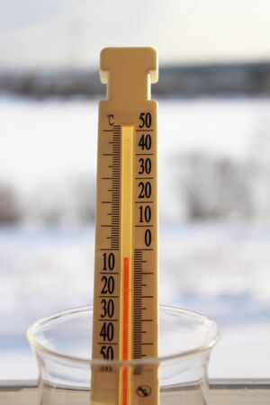 Thermometer shows on the street below zeroの写真素材