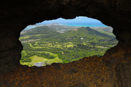 The view on Hawaii from a hole in the rock after Pali Puka trailの写真素材
