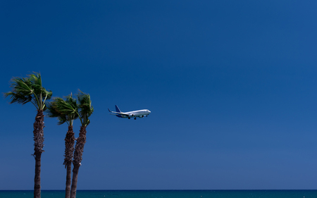 Plane on the beach. Mackenzie Beach. August 2018. Cyprus. Larnaca The plane is landing.の写真素材
