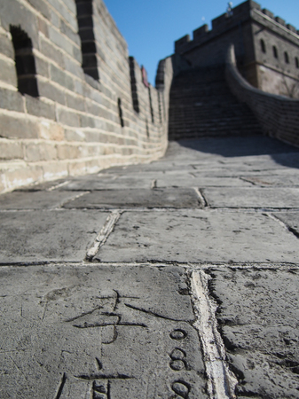 Grafitti carved into the stones that make up the Great Wall of China.の写真素材