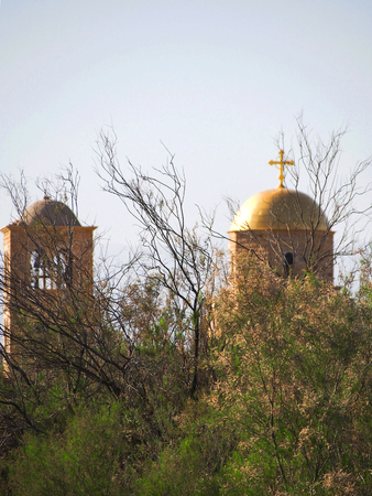 The gold dome and cross of an orthodox church at the holy site of Bethany Beyond the Jordan.の写真素材