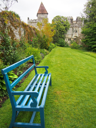 A bright blue bench in the garden of Lismore Castle in Ireland.のeditorial素材