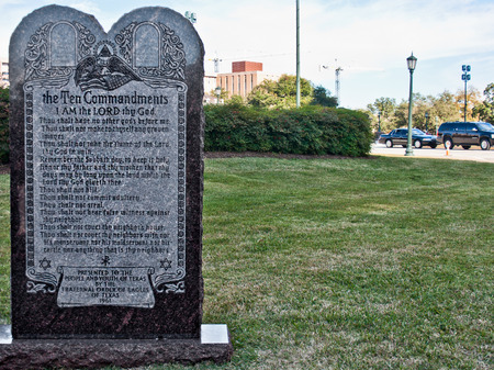 A monument with the ten commandments stands on the grounds of the Texas State Capitol Building in Austin, Texas.のeditorial素材