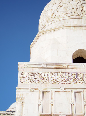 A white domed building with Arabic script in Jerusalem, Israel.の写真素材