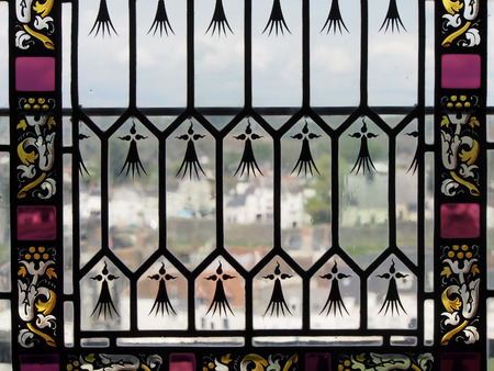 Looking out through a window with stained glass detail in Amboise, France.の写真素材