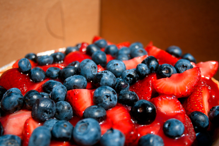 Detail of bright berries topping a pie.
