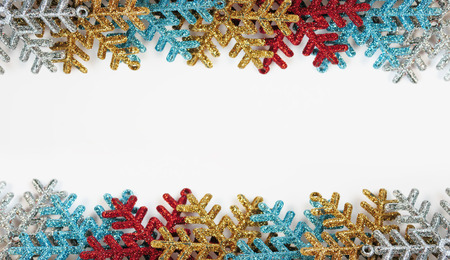 Colourful snowflakes on white background with copy space for your textの写真素材