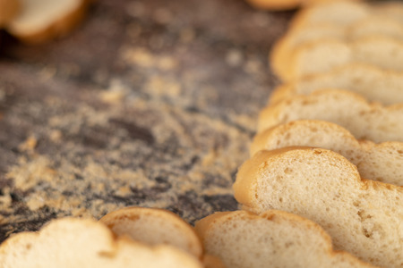 French breads sliced on the wooden table with copy spaceの写真素材