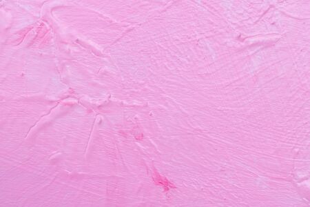 The texture of the rugged pink wall and structure background. Uneven wall paint of watercolor on a wooden floor.の写真素材