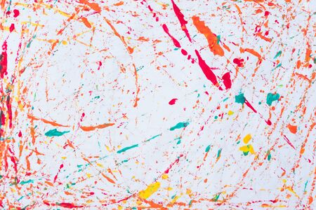Abstract background and texture colorful of water color splash on the white paper from paintbrush.の写真素材