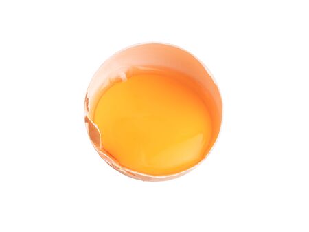 Egg yolks in a broken shell isolated on the white background with clipping pathsの写真素材
