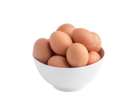 Raw chicken eggs in the white bowl isolated on the white background with clipping pathsの写真素材