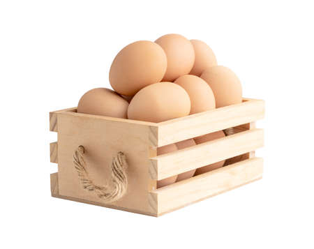 Chicken eggs in the wooden box isolated on the white background with clipping pathsの写真素材