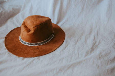 Cowboy hat on a white bed. High quality photoの写真素材