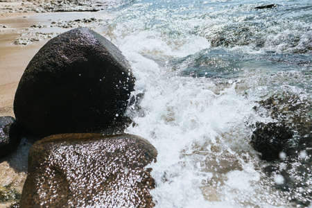 Sea waves wash the stones on the shore. Tropical vacation. High quality photoの写真素材