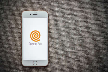 Yandex food app, iPhone with screen of yandex food appのeditorial素材